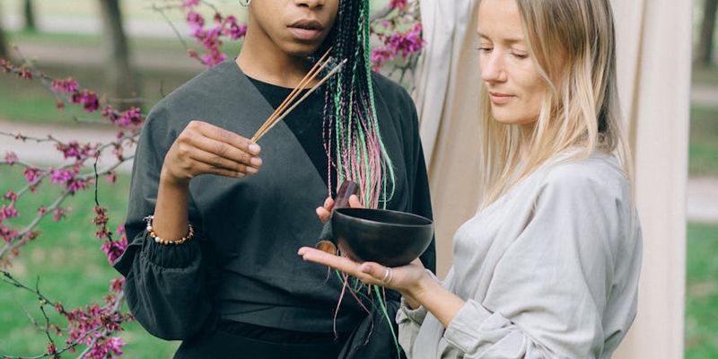 Portrait of a smiling yoga instructor in a calm setting.